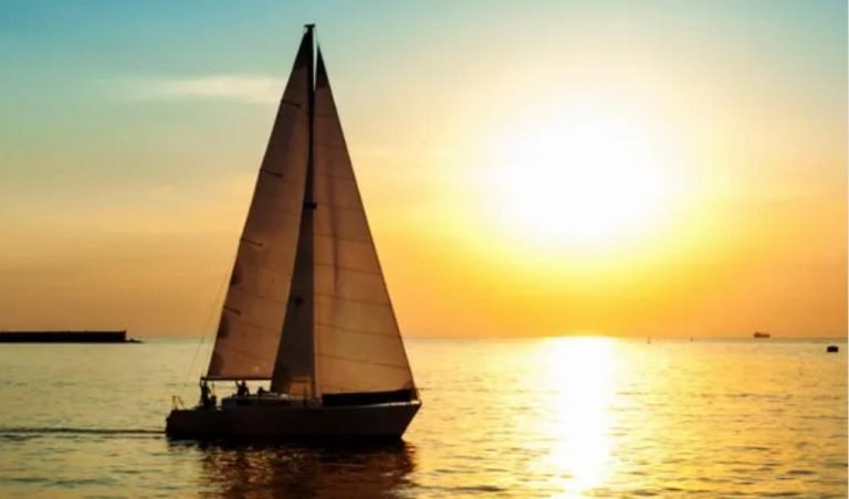 A sailboat on the sea in sunlight